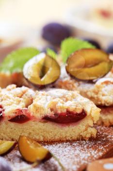 Slice of plum cake with crumb topping