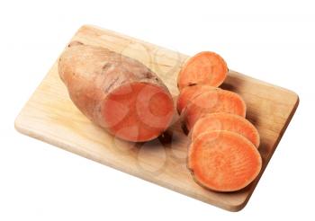 Sliced raw yam  on cutting board