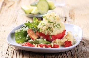 Vegetarian appetizer - Fresh tomato stuffed with couscous 
 
