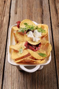 Corn chips, feta and sun dried tomatoes