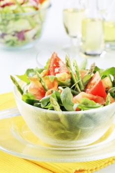 Bowl of greens with smoked salmon and asparagus 