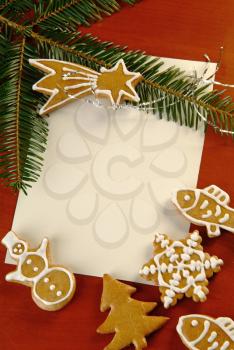 Christmas gingerbread and a blank sheet of paper
