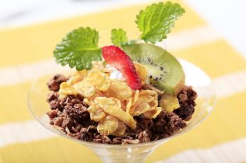 Variety of breakfast cereal garnished with fresh fruit