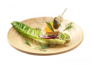 Bite-sized vegetarian appetizer on lettuce leaf