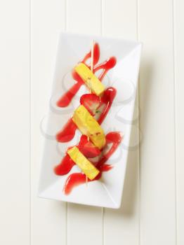 Pineapple and strawberry skewer with sweet sauce