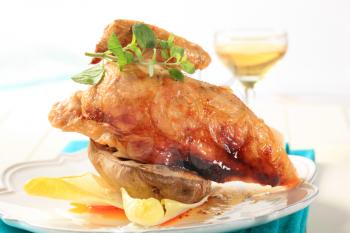 Roasted chicken with crispy skin and baked potato 