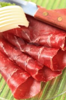 Thin slices of dried meat and butter