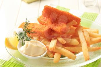 Fried fish sticks with French fries and creamy dip