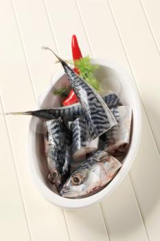 Pieces of raw mackerel in a casserole dish