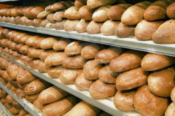Loaves of bread on shelves in a store