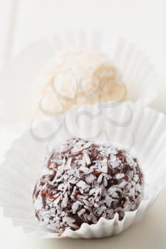 Coconut-coated chocolate balls in paper cases