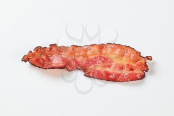 Crispy pan-fried strip of bacon