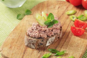 Slice of brown bread and meat spread