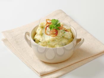 Mashed potato topped with browned onion
