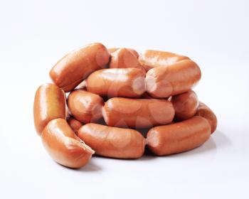 Studio shot of a pile of sausages 