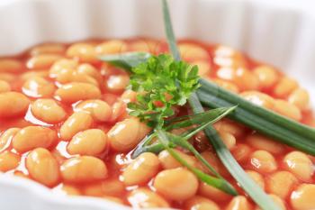 Macro shot of baked beans in a casserole dish