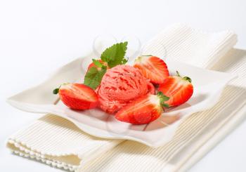 Scoop of strawberry ice cream with fresh fruit