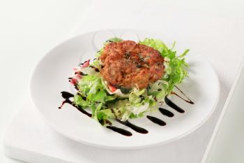 Vegetable burger with green salad