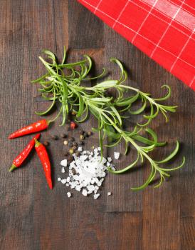 Fresh rosemary sprigs, peppercorns, red chili peppers and sea salt