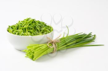 Studio shot of fresh chives - bunch and chopped