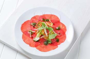 Beef Carpaccio with pesto sauce and Parmesan