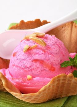 Pink fruit flavored ice cream in a waffle basket