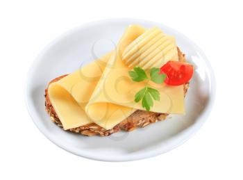 Whole grain bread with sliced cheese