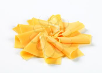 Thin slices of yellow cheese