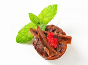 Mini chocolate cake topped with chocolate curls