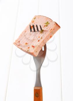 Slice of spicy meatloaf on fork