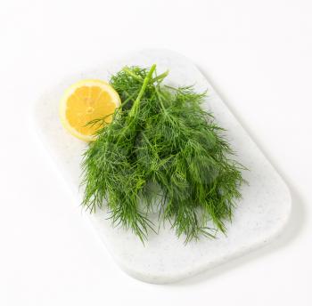 Sprigs of fresh dill weed on cutting board