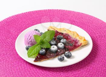 Slice of quark and blueberry flammkuchen with ice cream
