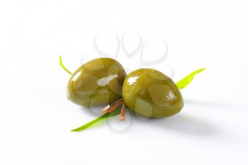 Unpitted green olives - studio shot