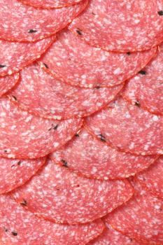 Thinly sliced salami infused with pieces of black truffles