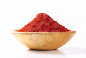 Paprika powder in a wooden bowl