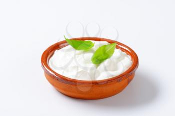 white yogurt in a ceramic bowl