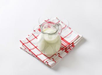 Fresh milk in glass pitcher