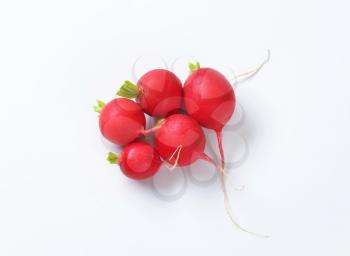 Fresh red radishes on white background