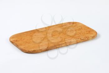 thin rectangular wooden cutting board