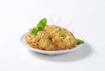 Italian flower-shaped vanilla cookies with bits of chocolate