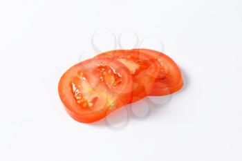 sliced red tomato on white background