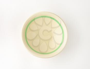 empty cereal bowl with green band on the inside