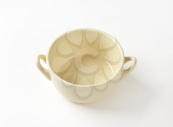 Beige ceramic soup bowl with two handles