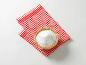 Coarse grained salt in wooden bowl