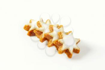 line of christmas star cookies on white background
