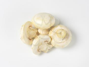 Overhead view of fresh white mushrooms