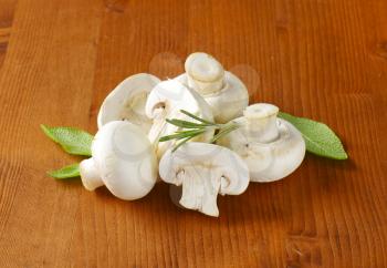 Fresh button mushrooms and culinary herbs