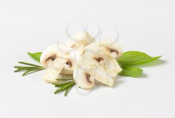 Raw white mushrooms with herbs