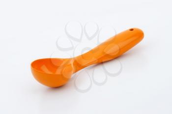 orange plastic ice cream scoop