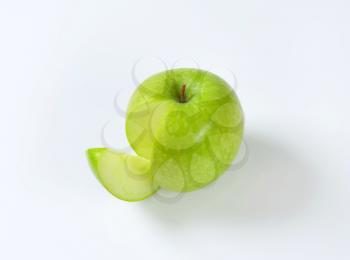 Green apple - a wedge cut off